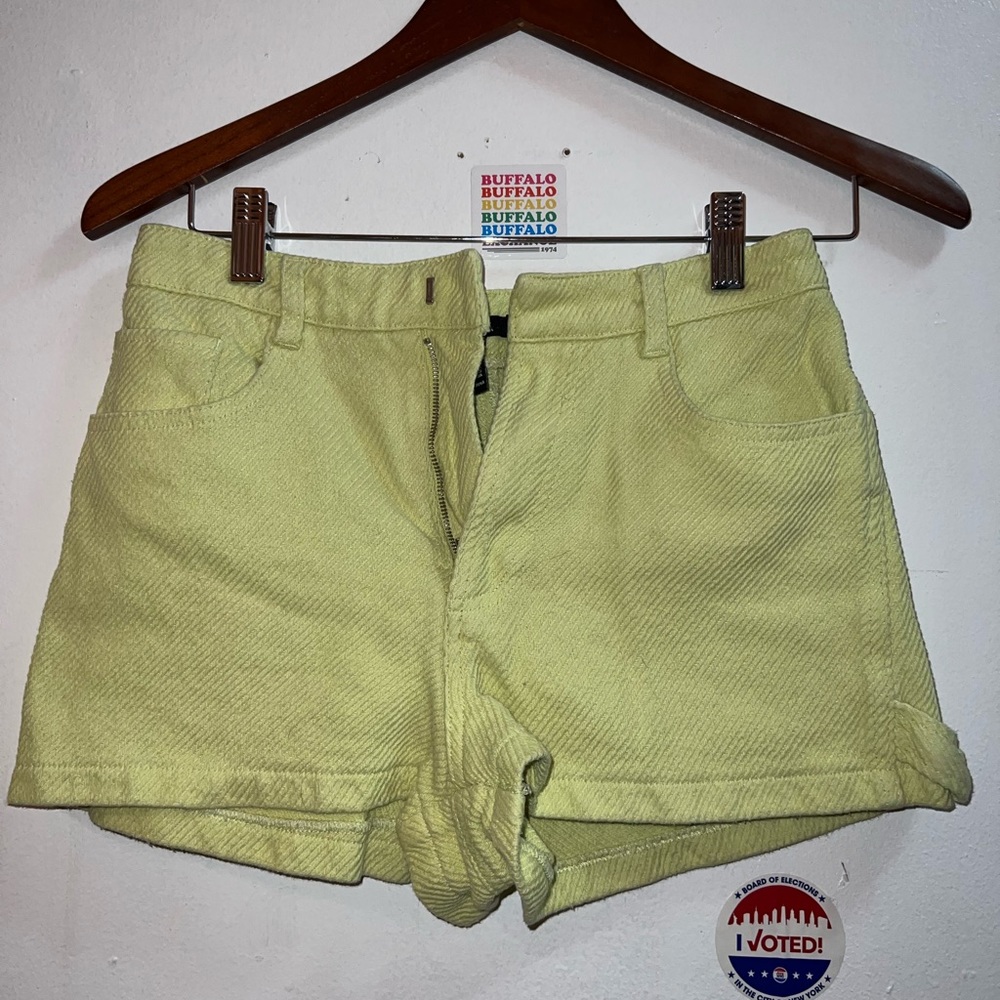 Green corduroy shorts.